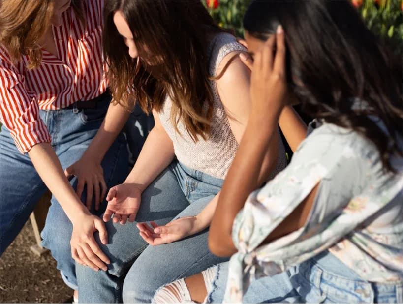 Women praying together in a small group